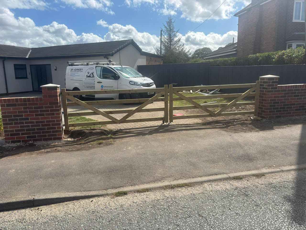 AP Joinery timber driveway gates with branded work van in Newcastle upon Tyne